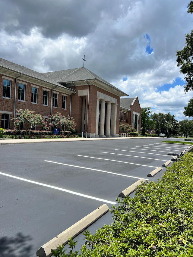 Completed parking lot sealcoating and fresh line striping at Jesuit High School Tampa