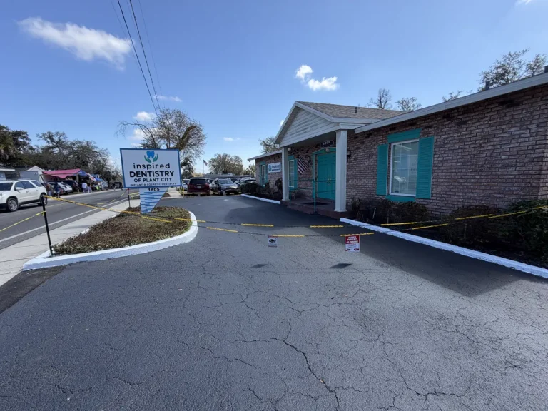 Fresh sealcoating completed lot Inspired Dentistry Plant City Florida by Radiant Striping