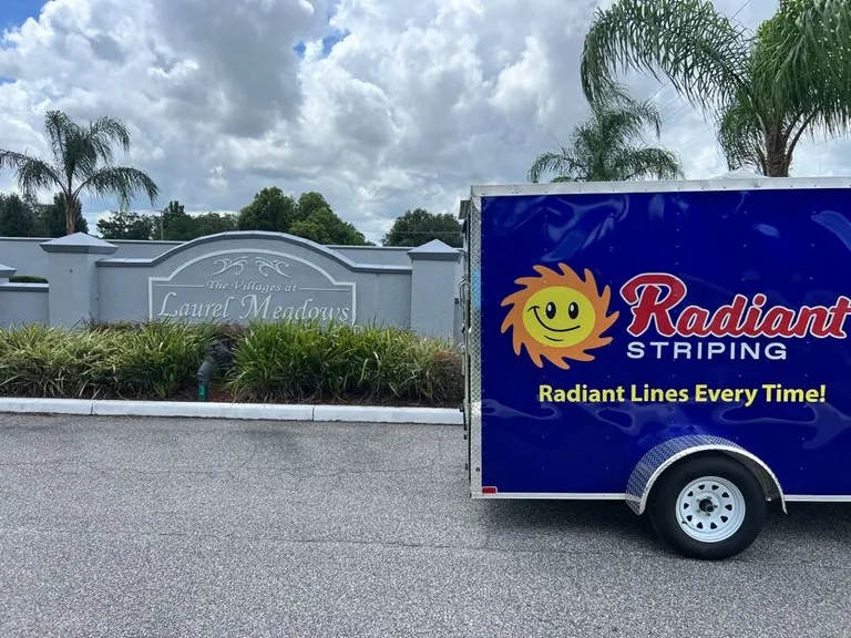 Radiant Striping trailer parked at the Villages of Laurel Meadows entrance in Bartow, Florida